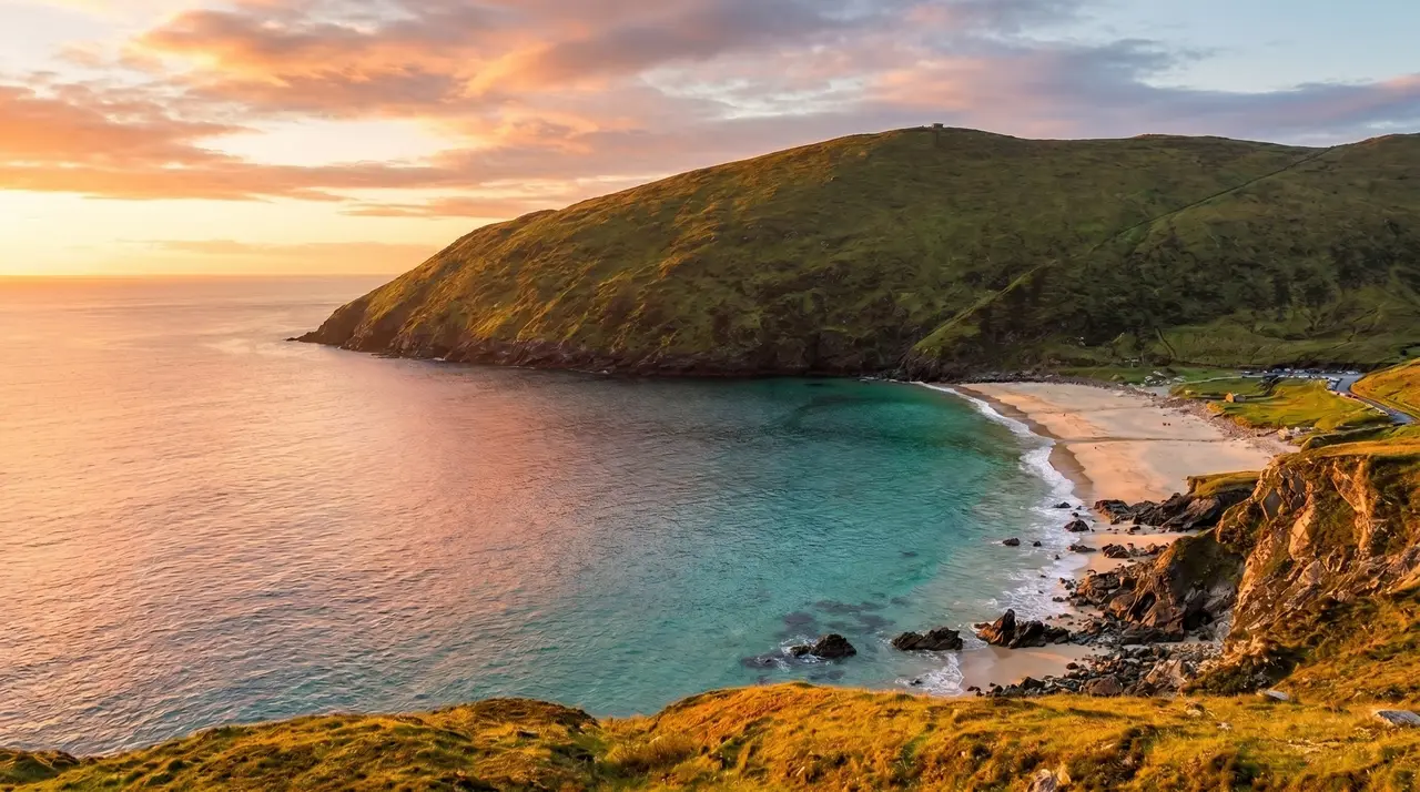 A sheltered sandy beach below a headland